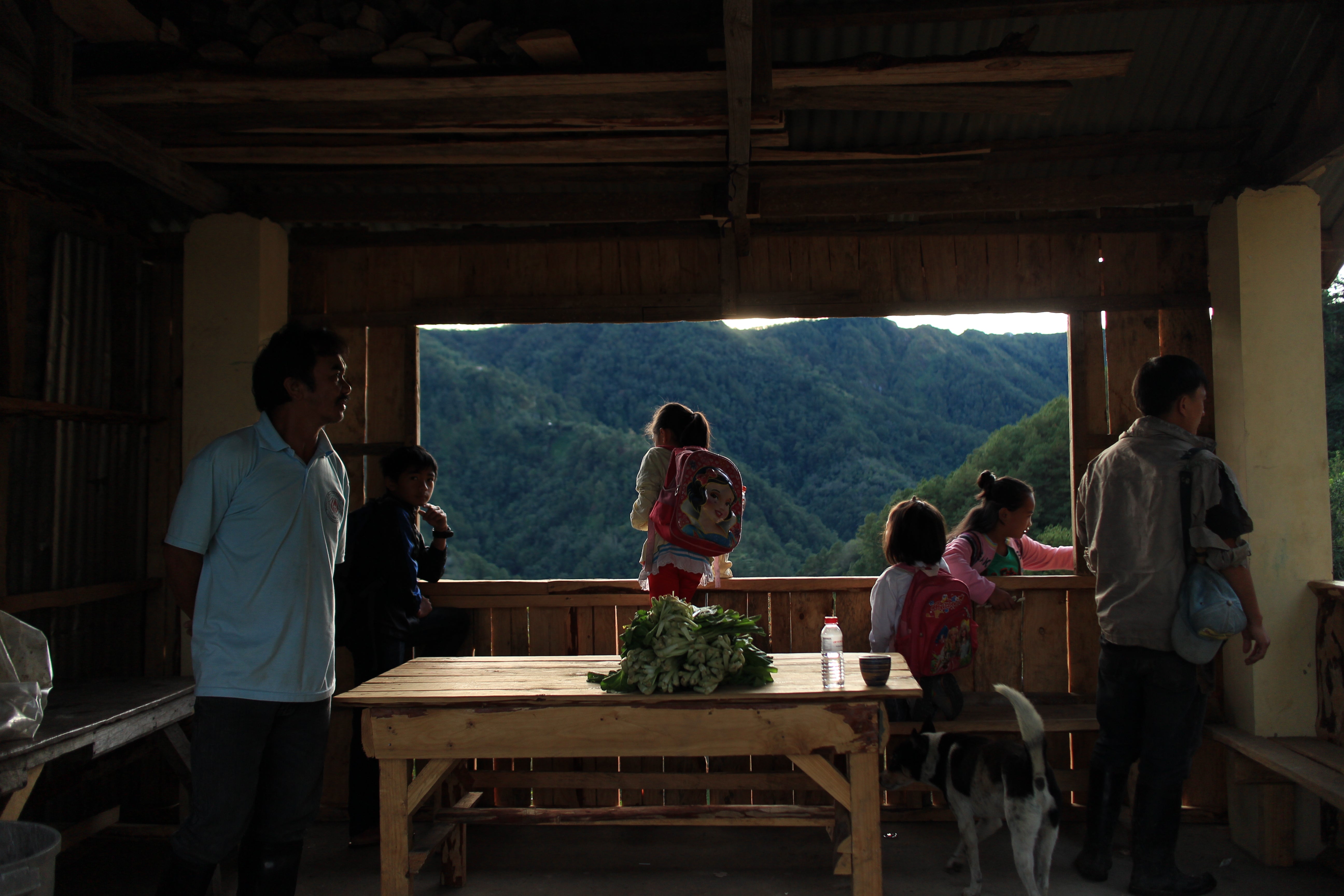 Community members gathered in a mountain home in Benguet