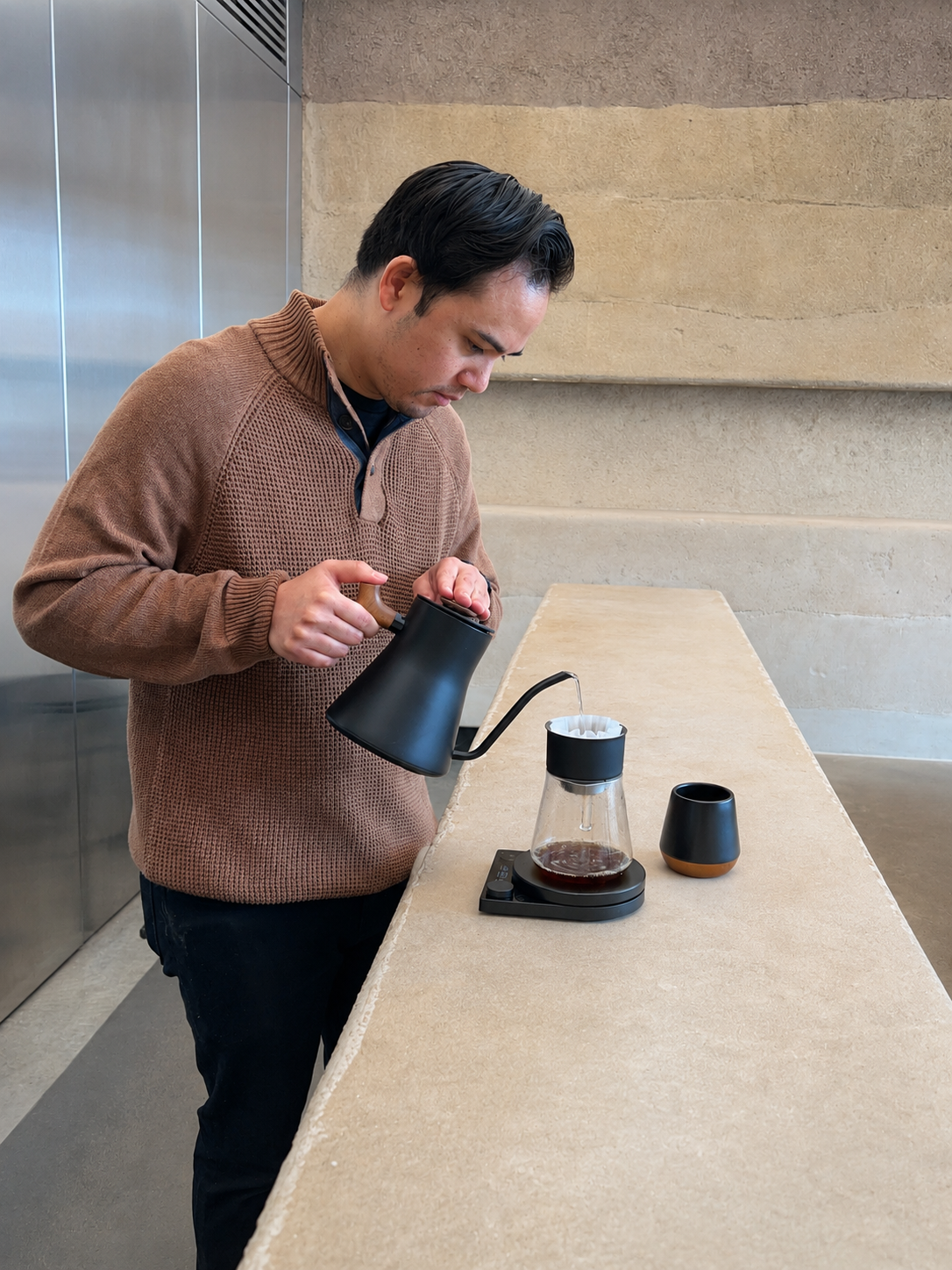 Matt, founder of Tadhana Coffee, making a pour-over coffee